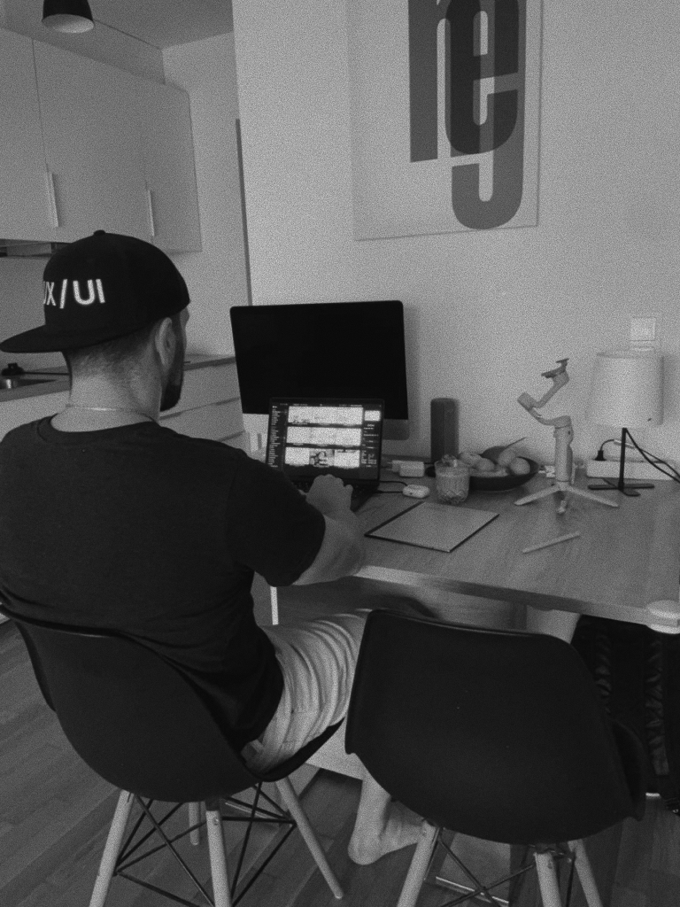 Pavlo working at a desk, seen from behind